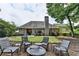 Outdoor seating area with chairs and a fire pit in the backyard at 1635 Lake Heights Cir, Dacula, GA 30019