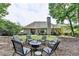Spacious backyard with outdoor seating surrounding a fire pit, ideal for entertaining friends at 1635 Lake Heights Cir, Dacula, GA 30019