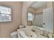 Bright bathroom with a single vanity, large mirror, and shower with tub at 1635 Lake Heights Cir, Dacula, GA 30019
