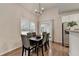 Bright breakfast nook features hardwood floors, modern lighting, and backyard access at 1635 Lake Heights Cir, Dacula, GA 30019