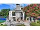 Elegant clubhouse with an outdoor fireplace, patio seating and lush landscaping at 1635 Lake Heights Cir, Dacula, GA 30019
