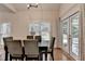 Dining room featuring hardwood floors, a modern table and a view of the patio at 1635 Lake Heights Cir, Dacula, GA 30019