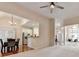 Spacious living room with open access to dining and kitchen areas, featuring vaulted ceilings and ample light at 1635 Lake Heights Cir, Dacula, GA 30019