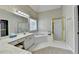 Bathroom featuring double sinks, enclosed shower and a soaking tub at 1635 Lake Heights Cir, Dacula, GA 30019