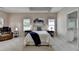 Comfortable main bedroom with a seating area, decorative artwork, and ensuite bath at 1635 Lake Heights Cir, Dacula, GA 30019
