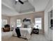 Spacious main bedroom boasts tray ceilings, fan, and large windows at 1635 Lake Heights Cir, Dacula, GA 30019
