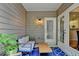Inviting patio with comfortable seating, stylish rug, and views of the lush surroundings at 1635 Lake Heights Cir, Dacula, GA 30019