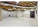 Unfinished basement with concrete walls, exposed ceiling, and potential for customization at 4685 Braselton Hwy, Hoschton, GA 30548