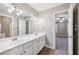 Neutral bathroom featuring double sinks and wood flooring at 4685 Braselton Hwy, Hoschton, GA 30548