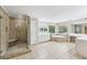 Spacious bathroom features a glass shower, a jetted tub, and double sinks with great natural light at 4685 Braselton Hwy, Hoschton, GA 30548