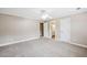 Neutral bedroom with carpeting and a doorway to an ensuite bathroom at 4685 Braselton Hwy, Hoschton, GA 30548