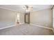 Neutral bedroom with carpeting and a doorway to an ensuite bathroom at 4685 Braselton Hwy, Hoschton, GA 30548