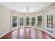 Charming breakfast nook with hardwood floors and a bay window overlooking the backyard at 4685 Braselton Hwy, Hoschton, GA 30548