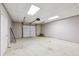 Two car garage with a functional door, cement floors, and ample space at 4685 Braselton Hwy, Hoschton, GA 30548