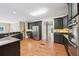 Well-equipped kitchen with stainless steel appliances, granite counters, and custom cabinetry at 4685 Braselton Hwy, Hoschton, GA 30548