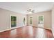 Bright living room features multiple windows and access to an outdoor patio at 4685 Braselton Hwy, Hoschton, GA 30548
