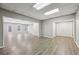 Spacious living room with wood-look floors, ample natural light, and neutral paint at 4685 Braselton Hwy, Hoschton, GA 30548