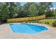 Backyard pool and spa with a patio, surrounded by a well-maintained fence at 4685 Braselton Hwy, Hoschton, GA 30548