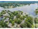 Stunning aerial view of lakefront homes nestled among lush green trees with tranquil water views and neighborhood charm at 1605 Spinnaker Drive, Alpharetta, GA 30005