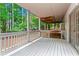 Covered back deck with a view of the yard at 1605 Spinnaker Drive, Alpharetta, GA 30005