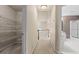 Hallway with a walk-in closet on the left and a bathroom on the right at 1605 Spinnaker Drive, Alpharetta, GA 30005