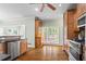 Well-equipped kitchen with stainless steel appliances, custom wood cabinets, granite countertops, and hardwood floors at 1605 Spinnaker Drive, Alpharetta, GA 30005