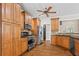 Spacious kitchen features stainless steel appliances, granite countertops, custom cabinetry, and hardwood flooring at 1605 Spinnaker Drive, Alpharetta, GA 30005