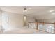 Bright loft featuring neutral walls, carpet floors, and a white ceiling fan for added comfort at 1605 Spinnaker Drive, Alpharetta, GA 30005