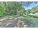 Fenced backyard, showcasing grass and a partial view of the brick home at 3991 Adamsville Sw Dr, Atlanta, GA 30331