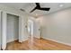 Bedroom featuring wood flooring, closet with bi-fold doors, and a ceiling fan at 3991 Adamsville Sw Dr, Atlanta, GA 30331