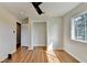 Bedroom featuring wood flooring, closet, a ceiling fan, and white walls at 3991 Adamsville Sw Dr, Atlanta, GA 30331