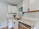 Bright kitchen featuring modern stainless steel appliances and white subway tile backsplash at 3991 Adamsville Sw Dr, Atlanta, GA 30331