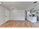 Open concept layout showcasing hardwood floors and a view into the updated kitchen at 3991 Adamsville Sw Dr, Atlanta, GA 30331