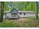 Beautiful backyard with deck, mature trees, and privacy at 5077 Martindale Ln, Stone Mountain, GA 30088