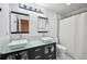 Contemporary bathroom with dual sinks, modern fixtures, and great lighting at 5077 Martindale Ln, Stone Mountain, GA 30088