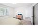 Well-lit bedroom featuring a desk, window, and closet at 5077 Martindale Ln, Stone Mountain, GA 30088