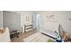 Bright Bedroom with a crib, changing table, and playful decor at 5077 Martindale Ln, Stone Mountain, GA 30088
