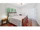 Bedroom with hardwood flooring, neutral colors, and ample natural light at 5077 Martindale Ln, Stone Mountain, GA 30088
