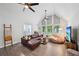 Sunlit living room with vaulted ceilings, stylish furniture, and an inviting, airy feel at 5077 Martindale Ln, Stone Mountain, GA 30088