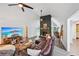 Spacious living room with stone fireplace and open layout to dining and kitchen areas at 5077 Martindale Ln, Stone Mountain, GA 30088