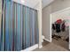 Tiled shower area in the bathroom with walk-in closet in the background at 5300 Peachtree Rd # 1608, Chamblee, GA 30341