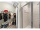 Bathroom showcasing a glass shower next to a walk-in closet with lots of storage space at 5300 Peachtree Rd # 1608, Chamblee, GA 30341