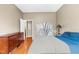 Comfortable bedroom with hardwood floors, a modern painting and a spacious dresser at 5300 Peachtree Rd # 1608, Chamblee, GA 30341