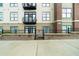 Apartment complex featuring balconies, brick and composite siding, decorative wreaths, and wrought iron at 5300 Peachtree Rd # 1608, Chamblee, GA 30341