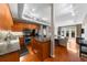 Open-concept kitchen with wood cabinets, stainless steel appliances, granite countertops, and hardwood floors at 5300 Peachtree Rd # 1608, Chamblee, GA 30341