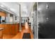 Open-concept living space with a kitchen, a living room, and a laundry room; hardwood floors throughout at 5300 Peachtree Rd # 1608, Chamblee, GA 30341