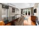 Spacious living room with sleek flooring, an elegant dining table, and access to a charming outdoor space at 5300 Peachtree Rd # 1608, Chamblee, GA 30341