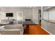 Open-concept living and dining area features modern furnishings, wood flooring and bright, natural light at 5300 Peachtree Rd # 1608, Chamblee, GA 30341