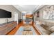 Cozy living room offers hardwood flooring, a wall-mounted television, and seamless flow into the kitchen at 5300 Peachtree Rd # 1608, Chamblee, GA 30341