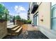 Private patio area with space for outdoor seating and relaxation; landscaped with mulch, stone, and brick at 5300 Peachtree Rd # 1608, Chamblee, GA 30341